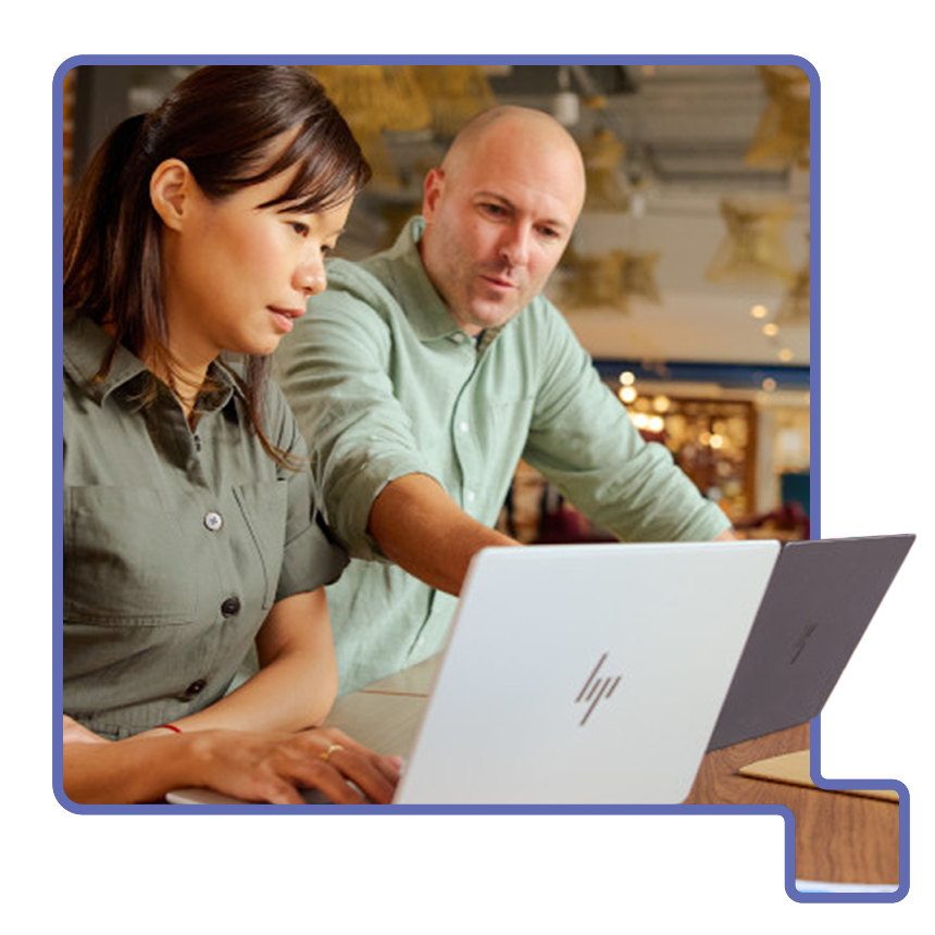 Two people discussing their hybrid workplace security